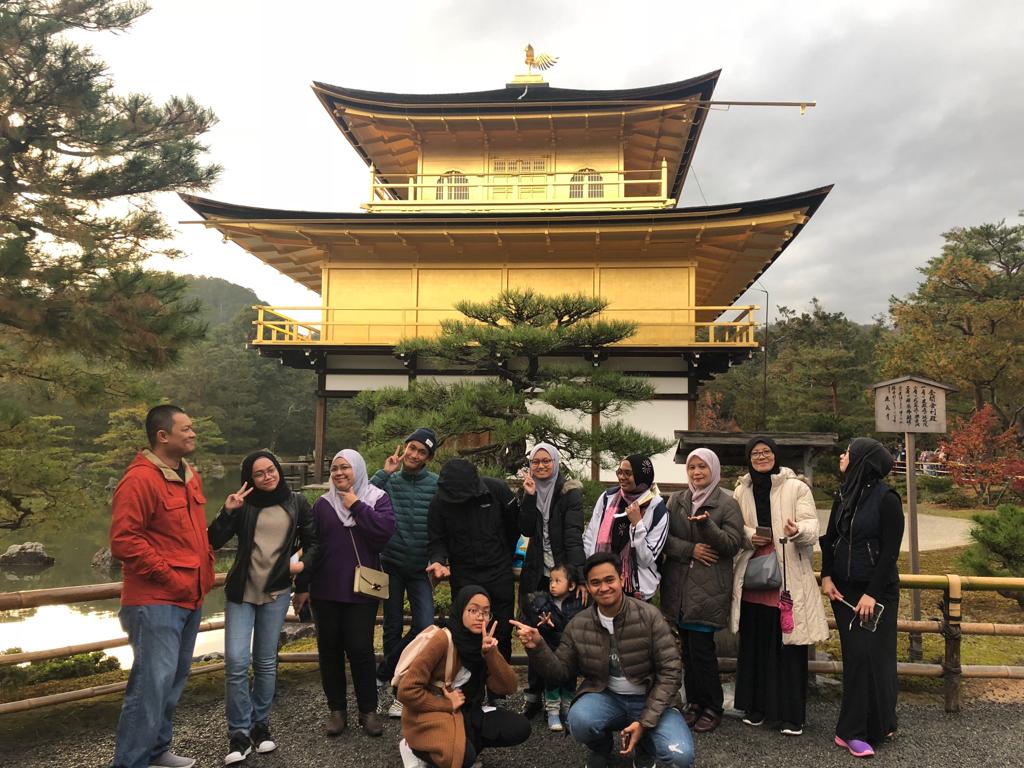 The golden reflection of Kinkaku-ji Temple under the Kyoto sky.